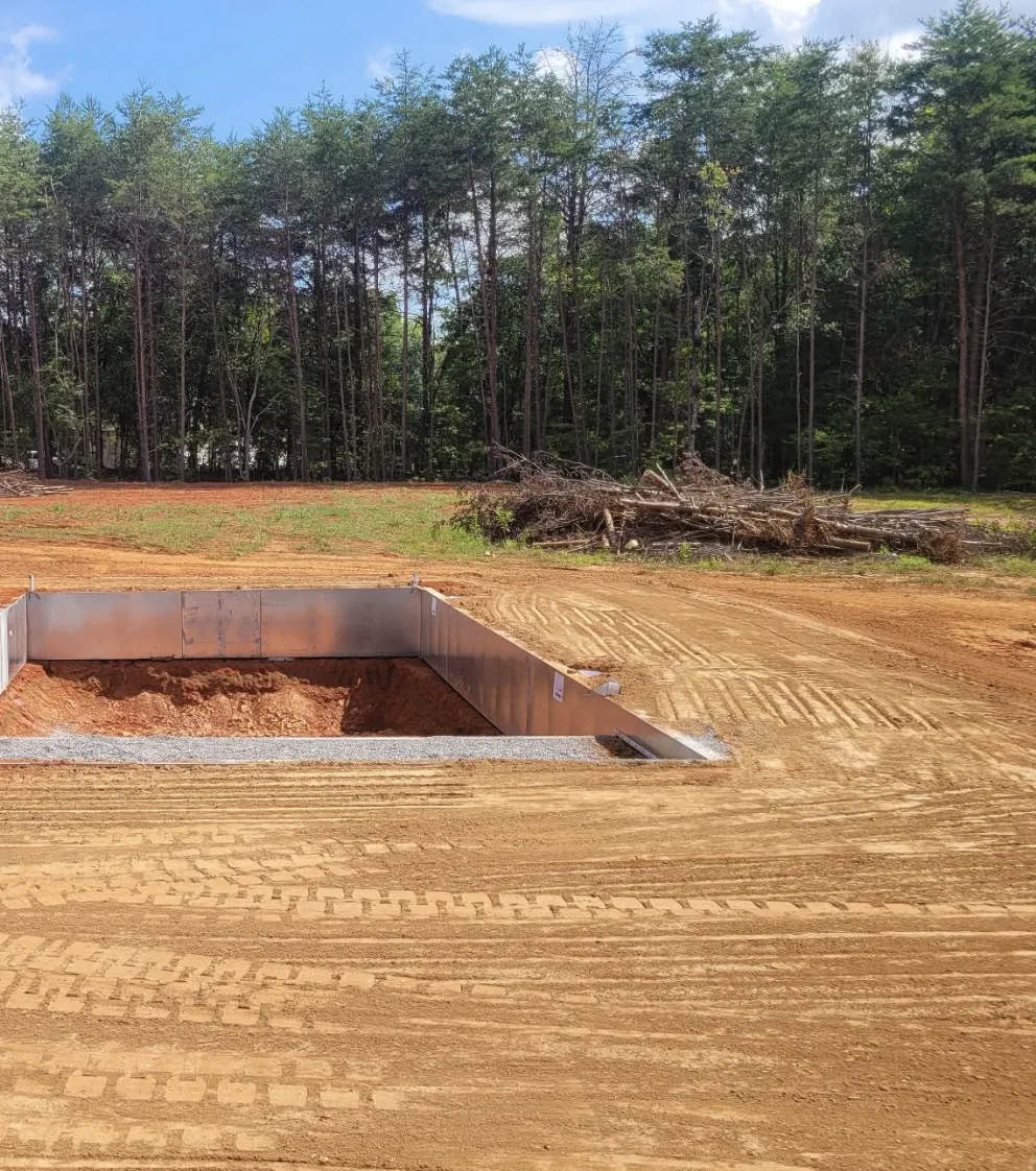 Steel wall panels set in a fresh pool excavation — Little Acres Grading